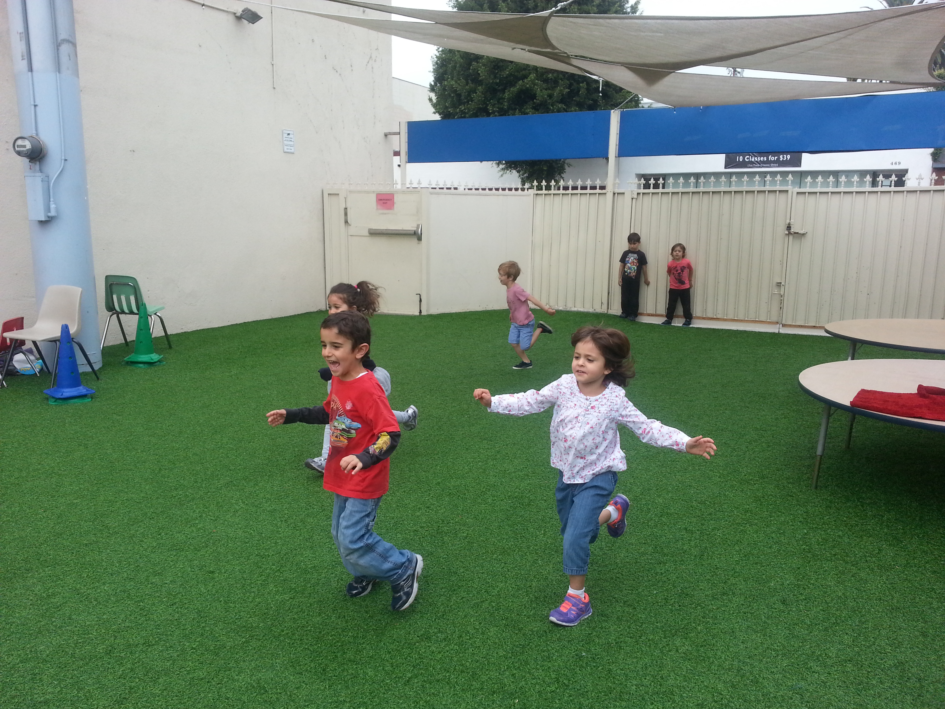 KCA kids run on the new turf yard